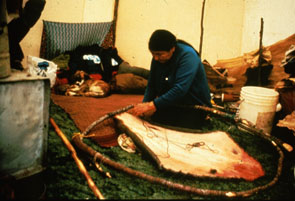 An-Mani Penashue stringing a beaver hide to stretcher in preparation for scraping and drying in her tent at Enakapeshakamau. Photo Nigel Markham, courtesy Innu Nation.