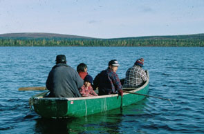 Shuash Gregoire, Pinute Poker, Shuash Gregoire Jr., and Kaniuekutat on a fishing trip at Ushpuakaniss. Photo courtesy Prote Poker.
